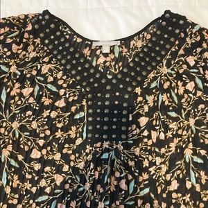Pleated Floral Tunic with 3/4 bell sleeves and studded neckline. NWOT